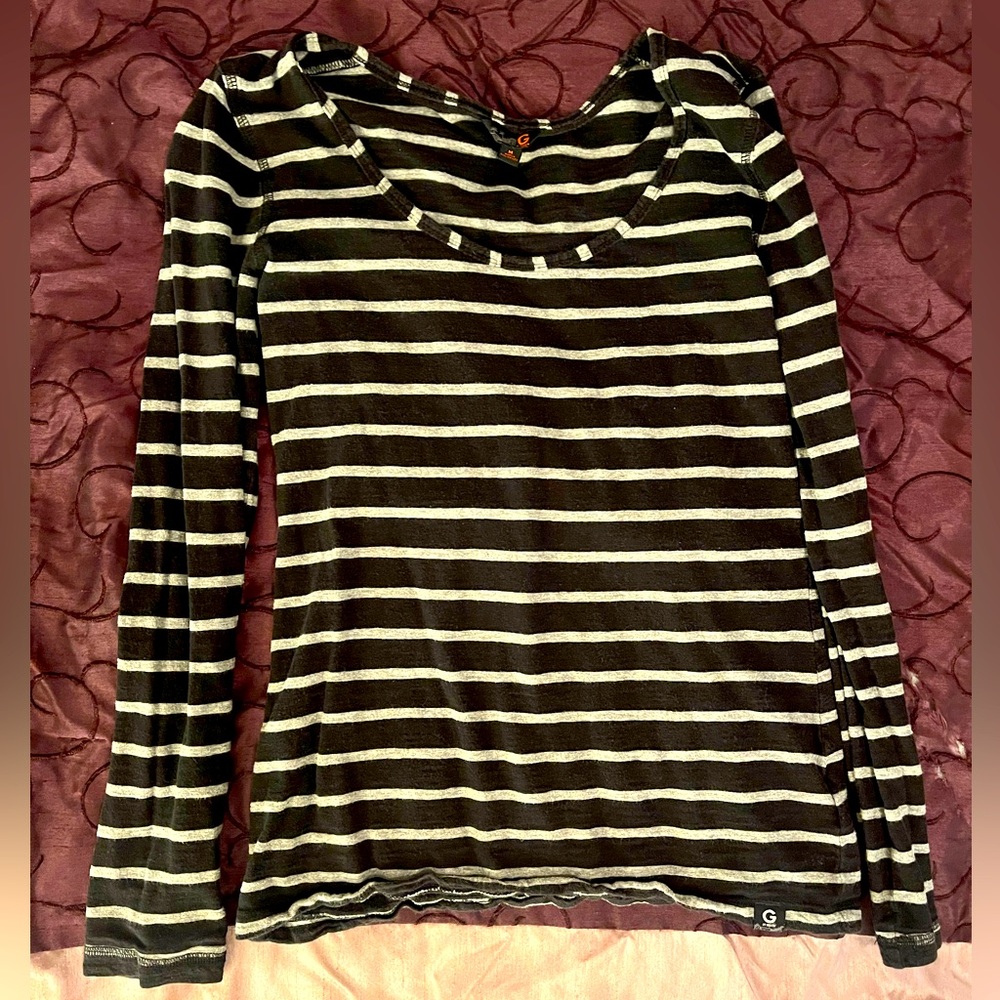 Two G by Guess shirts. Multicolored. Multiple sizes. Medium wear.